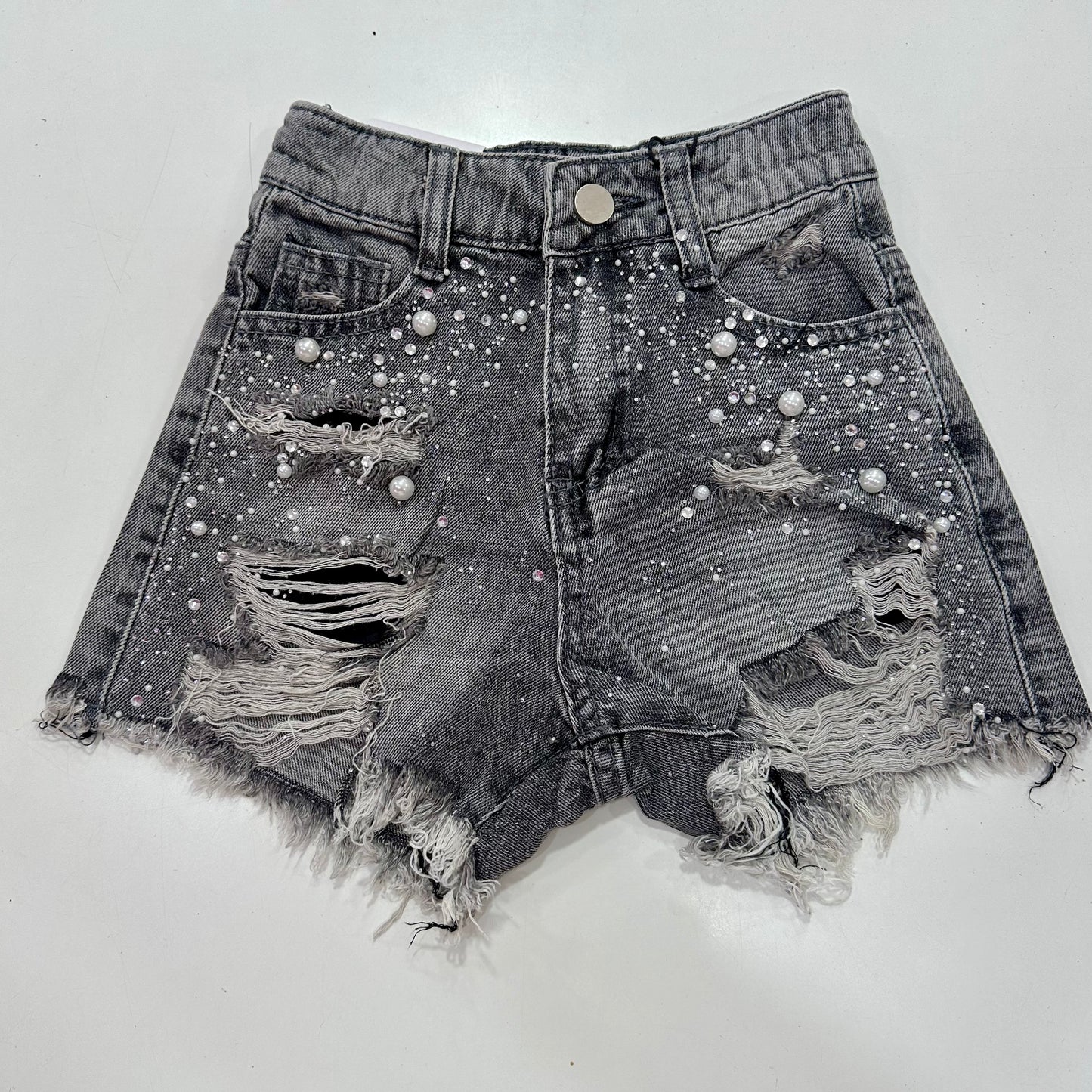 Short roto y pedrería